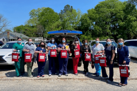 Vidant team members pose with Stop the Bleed kits.